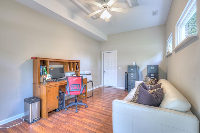 home office featuring wood finished floors, a ceiling fan, and baseboards