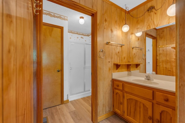 bathroom featuring wood finished floors and vanity