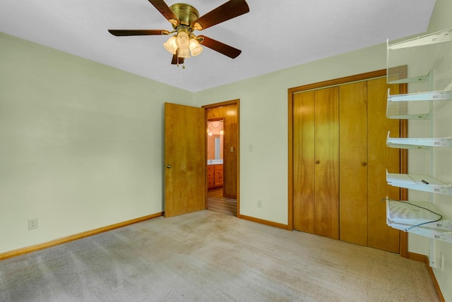 unfurnished bedroom with baseboards, carpet flooring, a ceiling fan, and a closet