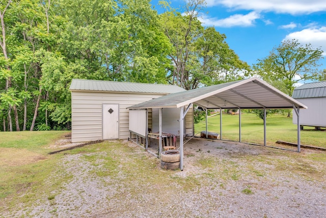 view of outbuilding featuring a carport and an outdoor structure