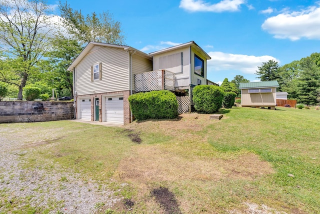 view of home's exterior with an attached garage, a yard, driveway, and brick siding
