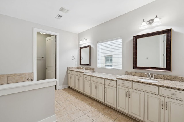 1000 Swanson Ln, Franklin, TN 37064 - bathroom with tile patterned floors, double vanity, and baseboards