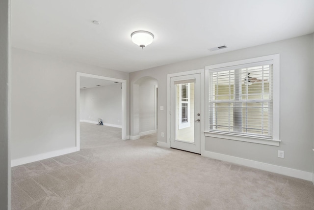 1000 Swanson Ln, Franklin, TN 37064 - carpeted empty room featuring arched walkways and baseboards
