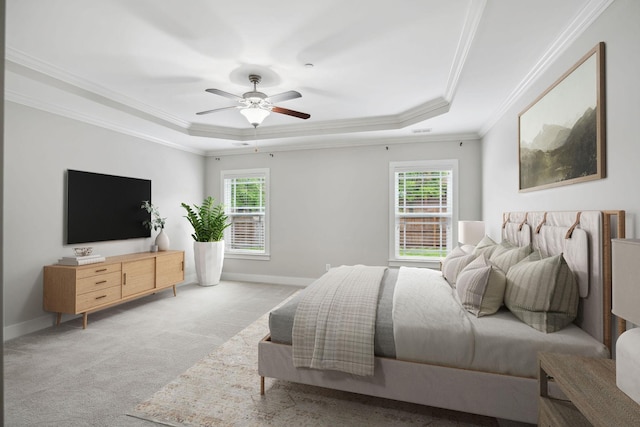 1000 Swanson Ln, Franklin, TN 37064 - bedroom featuring a tray ceiling, light carpet, crown molding, baseboards, and a ceiling fan