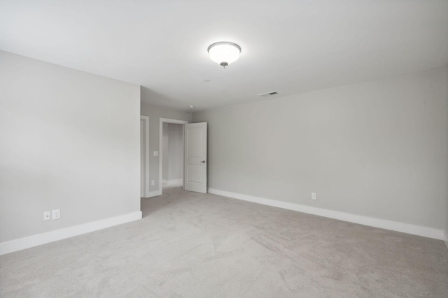 1000 Swanson Ln, Franklin, TN 37064 - spare room featuring light colored carpet and baseboards