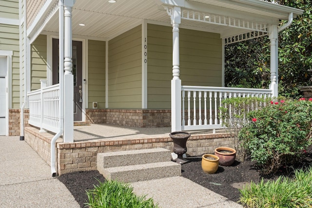 1000 Swanson Ln, Franklin, TN 37064 - doorway to property with a porch and brick siding