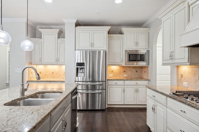 1000 Swanson Ln, Franklin, TN 37064 - kitchen featuring stainless steel appliances, a sink, dark wood-style flooring, decorative backsplash, and white cabinetry