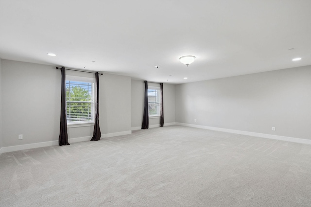 1000 Swanson Ln, Franklin, TN 37064 - empty room with healthy amount of natural light, light colored carpet, baseboards, and recessed lighting