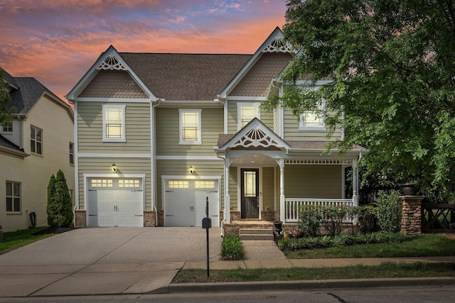 1000 Swanson Ln, Franklin, TN 37064 - view of front of home with a porch, a garage, and concrete driveway