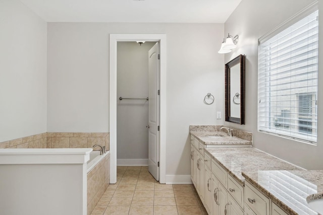 1000 Swanson Ln, Franklin, TN 37064 - full bathroom featuring vanity, a garden tub, tile patterned floors, and baseboards