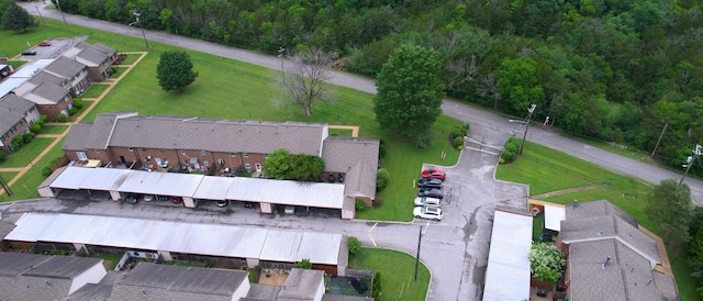 aerial view of property's location featuring a heavily wooded area