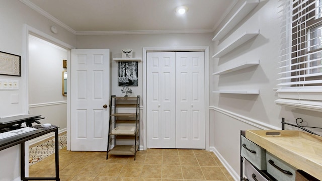 office with ornamental molding, light tile patterned floors, and baseboards