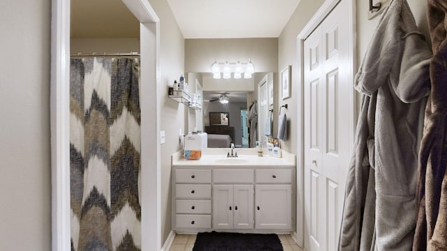 full bath with ceiling fan, tile patterned floors, vanity, and curtained shower