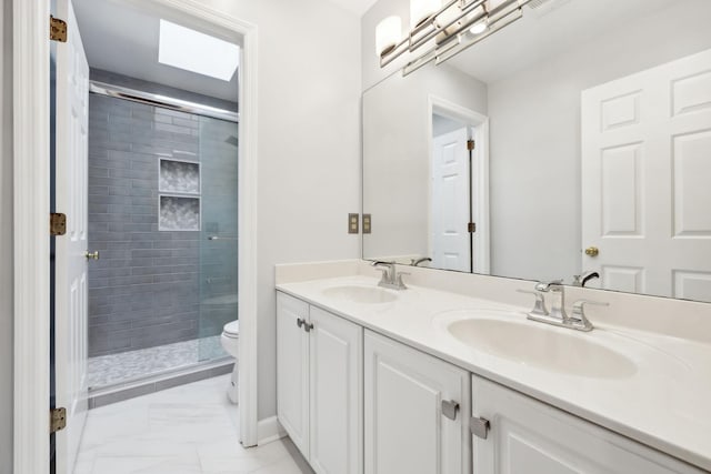 410 Springhouse Ct, Franklin, TN 37067 - bathroom featuring marble look tile flooring, toilet, a stall shower, double vanity, and baseboards