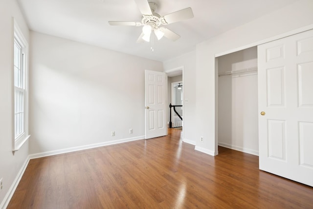 410 Springhouse Ct, Franklin, TN 37067 - unfurnished bedroom with wood finished floors, baseboards, a closet, and a ceiling fan