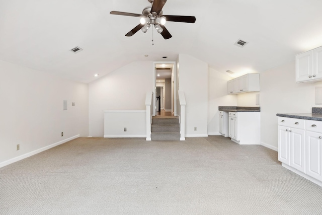 410 Springhouse Ct, Franklin, TN 37067 - unfurnished living room featuring a ceiling fan, light colored carpet, lofted ceiling, stairway, and baseboards