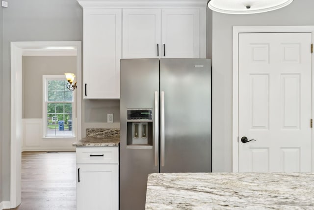 410 Springhouse Ct, Franklin, TN 37067 - kitchen featuring stainless steel fridge, wood finished floors, white cabinetry, light stone counters, and a chandelier