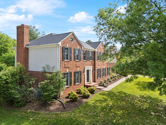 410 Springhouse Ct, Franklin, TN 37067 - rear view of house featuring a chimney, brick siding, and a lawn