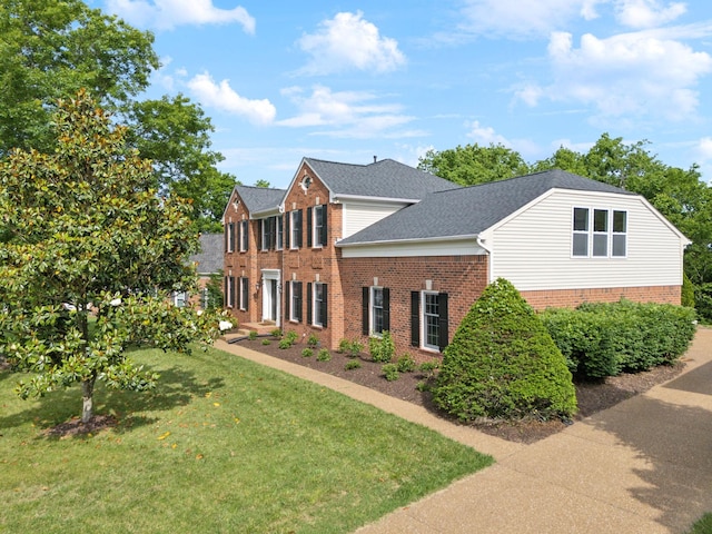410 Springhouse Ct, Franklin, TN 37067 - colonial inspired home with brick siding, a front yard, and roof with shingles