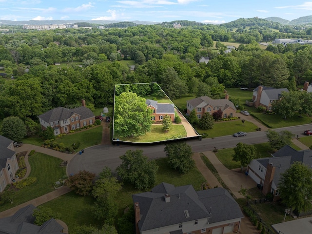 410 Springhouse Ct, Franklin, TN 37067 - aerial view of residential area with property boundaries highlighted, mountains, and a heavily wooded area