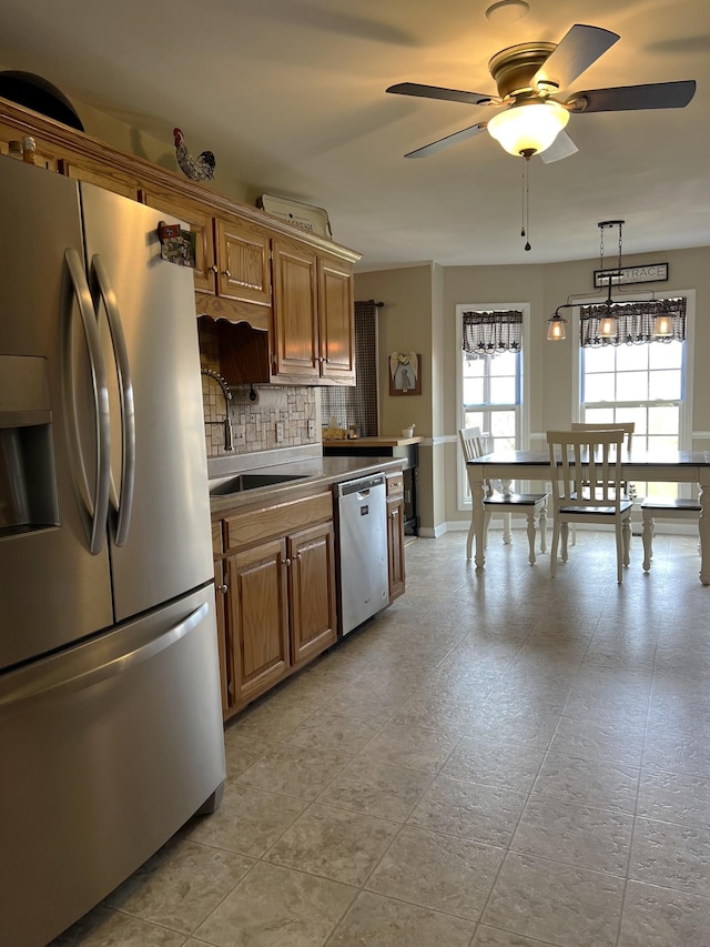 1224 Whiteside Hill Rd, Wartrace, TN 37183 - kitchen with stainless steel appliances, backsplash, ceiling fan, a sink, and light countertops