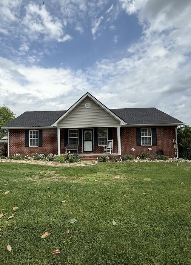 1051 Pinnacle Way, Castalian Springs, TN 37031 - single story home featuring a porch, brick siding, and a front lawn