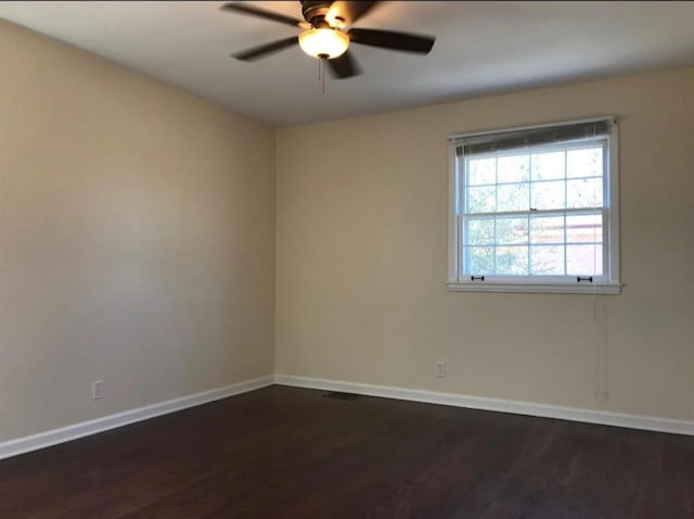 514 Wren Dr, Clarksville, TN 37040 - spare room featuring dark wood-style flooring, baseboards, and ceiling fan