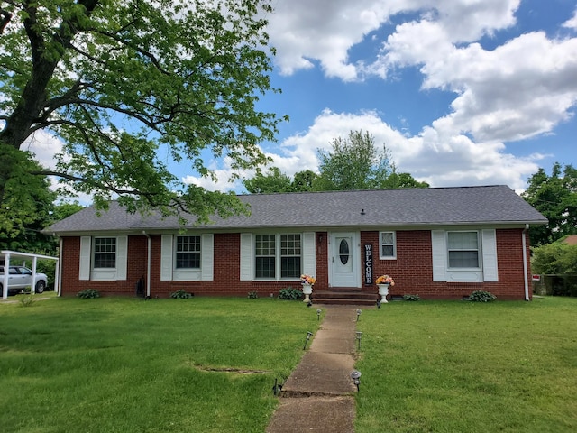 514 Wren Dr, Clarksville, TN 37040 - ranch-style home featuring brick siding, a front lawn, and a shingled roof