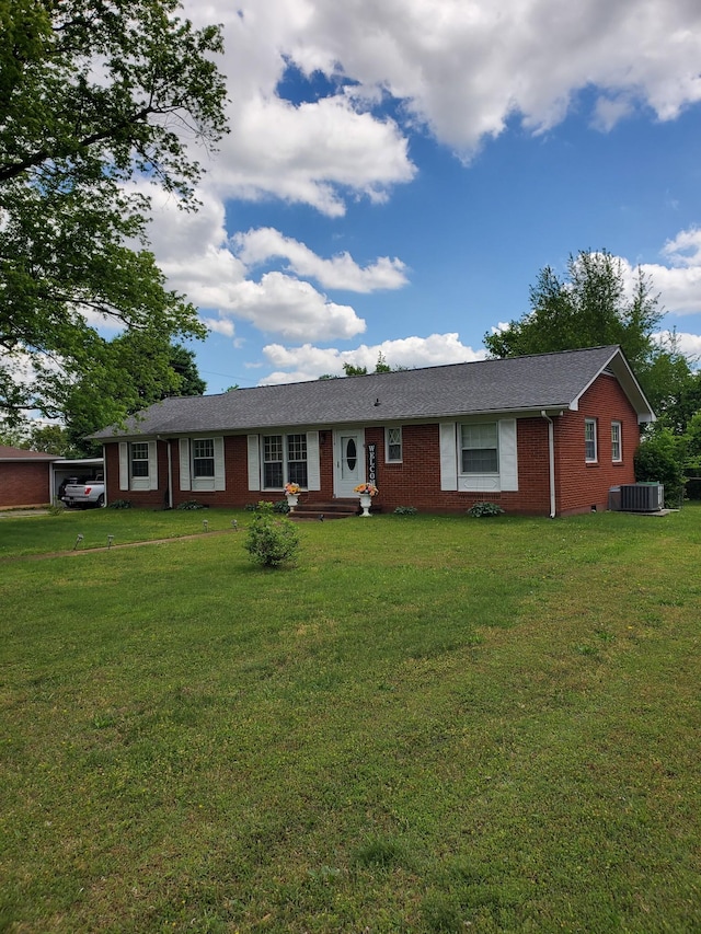 514 Wren Dr, Clarksville, TN 37040 - ranch-style home with brick siding, a front lawn, and central air condition unit