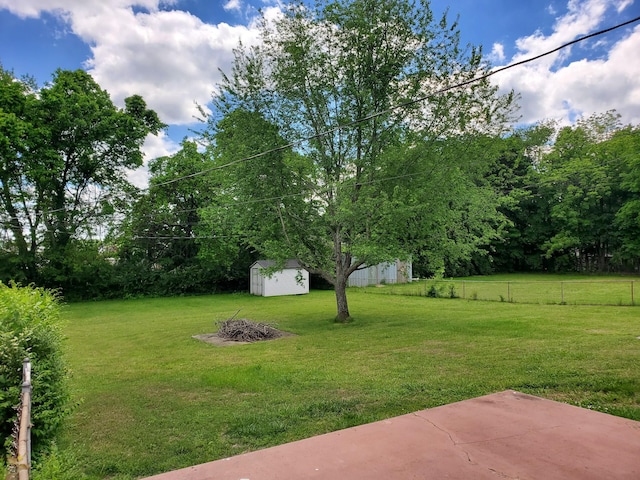 514 Wren Dr, Clarksville, TN 37040 - view of yard with a storage unit, an outdoor structure, and a patio