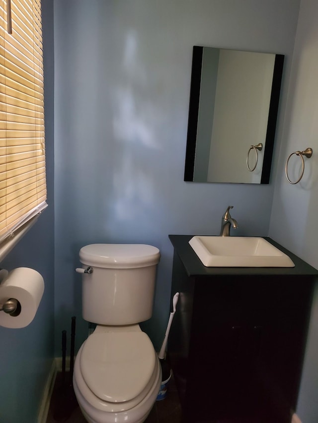 514 Wren Dr, Clarksville, TN 37040 - half bathroom featuring toilet, vanity, and baseboards