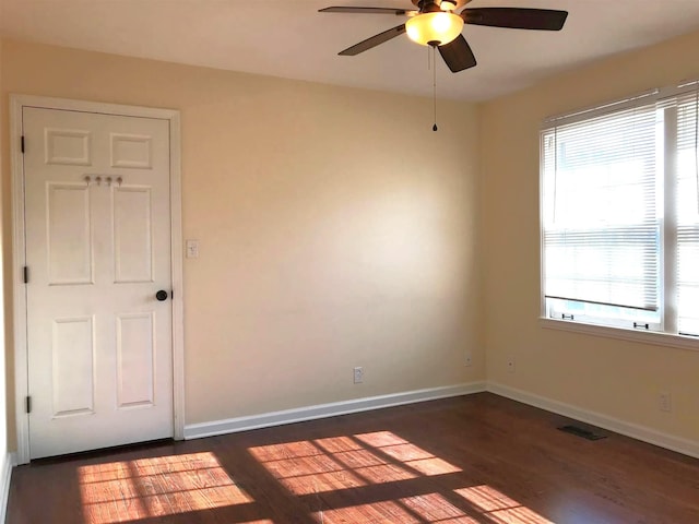 514 Wren Dr, Clarksville, TN 37040 - spare room with a ceiling fan, dark wood-style floors, and baseboards