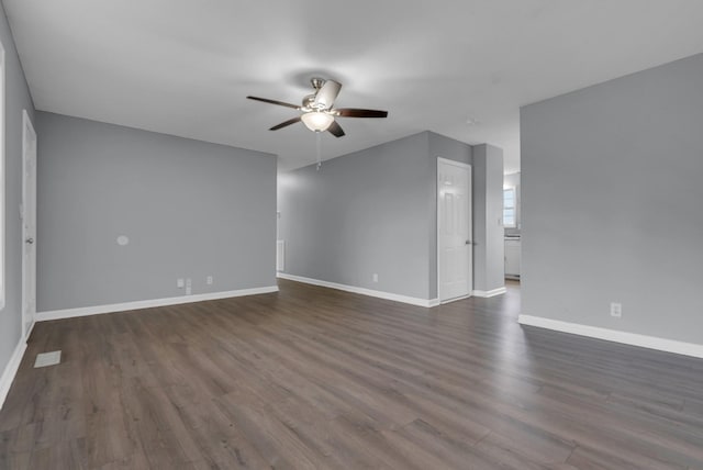 1493 Mcclardy Rd, Clarksville, TN 37042 - unfurnished living room with a ceiling fan, dark wood-type flooring, and baseboards