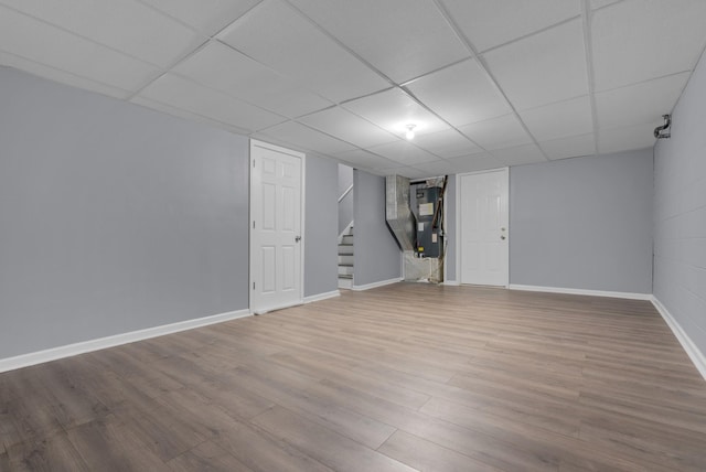 1493 Mcclardy Rd, Clarksville, TN 37042 - finished basement featuring stairs, wood finished floors, baseboards, and a paneled ceiling