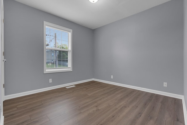 1493 Mcclardy Rd, Clarksville, TN 37042 - spare room with baseboards and dark wood-style flooring