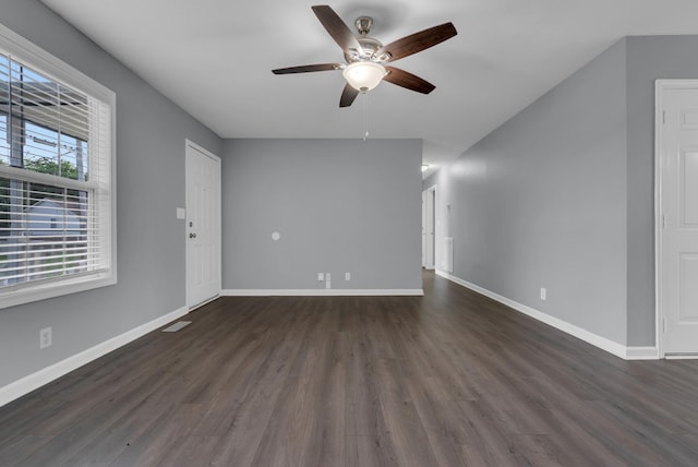 1493 Mcclardy Rd, Clarksville, TN 37042 - unfurnished living room featuring ceiling fan, dark wood finished floors, and baseboards