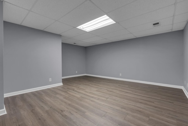 1493 Mcclardy Rd, Clarksville, TN 37042 - unfurnished room featuring a paneled ceiling, wood finished floors, and baseboards