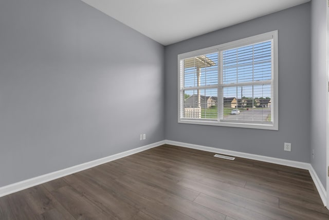 1493 Mcclardy Rd, Clarksville, TN 37042 - spare room featuring baseboards and dark wood-style floors