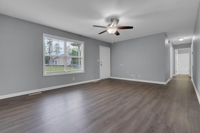 1493 Mcclardy Rd, Clarksville, TN 37042 - unfurnished living room with ceiling fan, dark wood-style flooring, and baseboards
