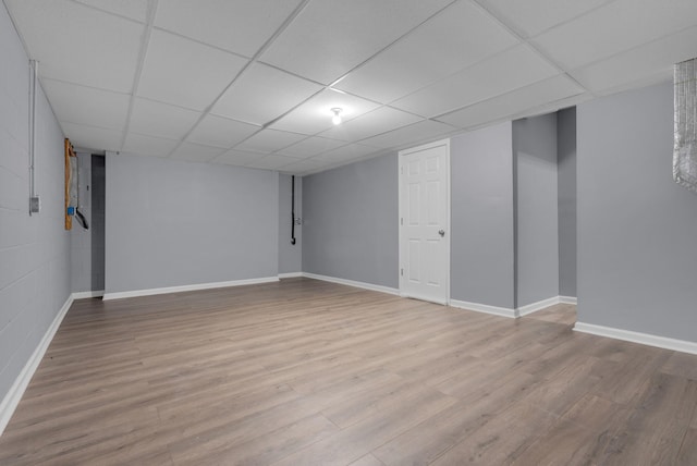 1493 Mcclardy Rd, Clarksville, TN 37042 - finished basement featuring a paneled ceiling, baseboards, and wood finished floors