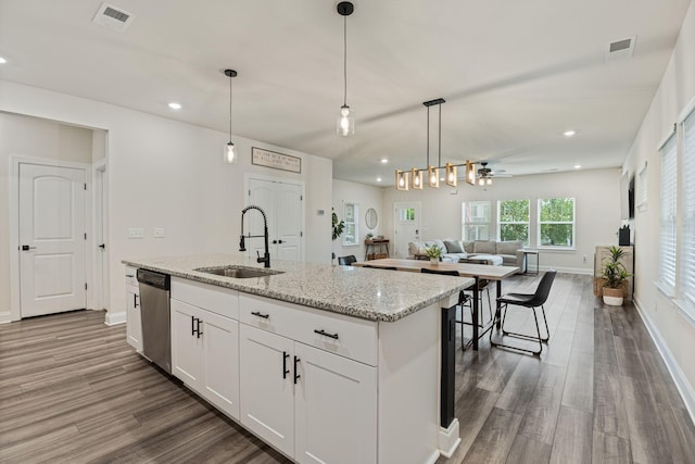 654 Taylor Bend Rd, Columbia, TN 38401 - kitchen with a sink, dishwasher, open floor plan, wood finished floors, and recessed lighting