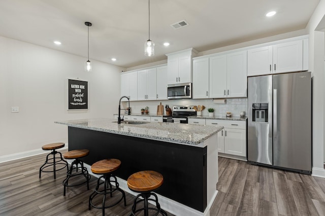 654 Taylor Bend Rd, Columbia, TN 38401 - kitchen featuring stainless steel appliances, a sink, dark wood-style flooring, white cabinetry, and recessed lighting