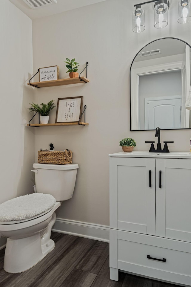 654 Taylor Bend Rd, Columbia, TN 38401 - half bath with toilet, baseboards, vanity, and wood finished floors