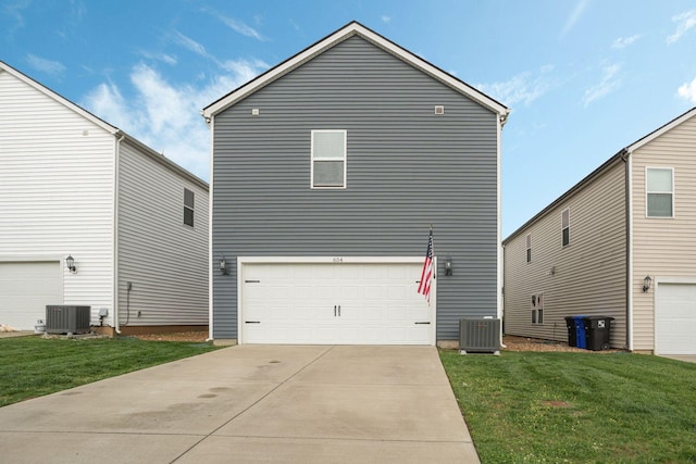 654 Taylor Bend Rd, Columbia, TN 38401 - rear view of property featuring central air condition unit, a lawn, and an attached garage