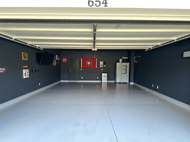 654 Taylor Bend Rd, Columbia, TN 38401 - garage featuring baseboards and refrigerator