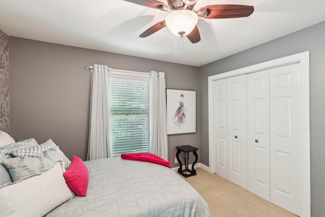 bedroom featuring carpet flooring, a closet, and a ceiling fan