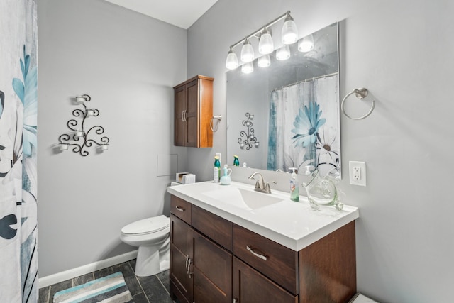full bathroom with toilet, vanity, baseboards, and a shower with shower curtain