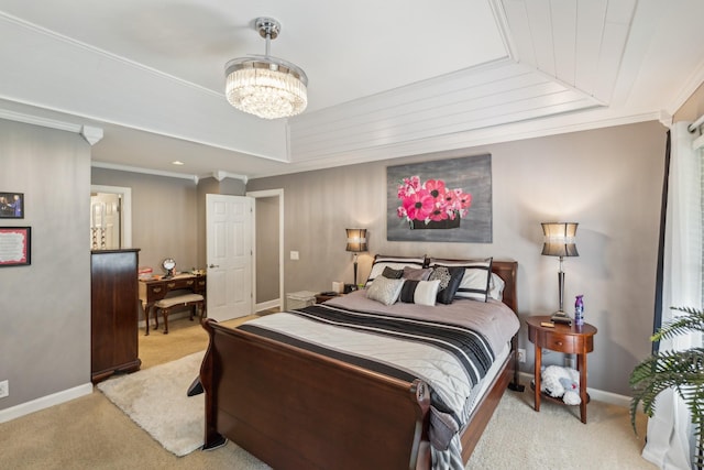 carpeted bedroom featuring baseboards, a chandelier, ornamental molding, and a raised ceiling