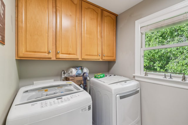 laundry room with cabinet space and washer and dryer