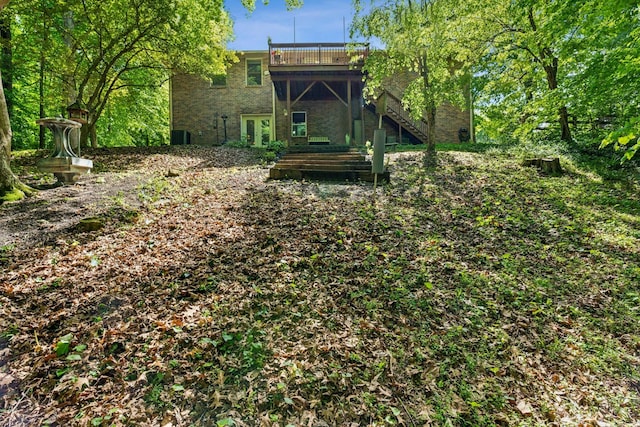 back of house with stairway and a deck